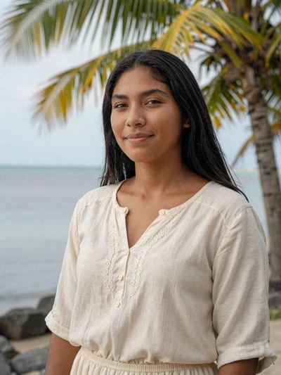Yamileth, 25, Belizean Maya-Mestizo woman from Corozal with black hair in cream blouse near bay waterfront - verified dating profile