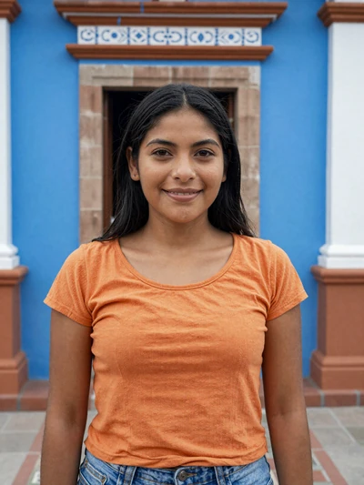 Wendy, 26, Salvadoran woman from Suchitoto in orange top at a colorful colonial doorway - Latin 312 Dating verified profile